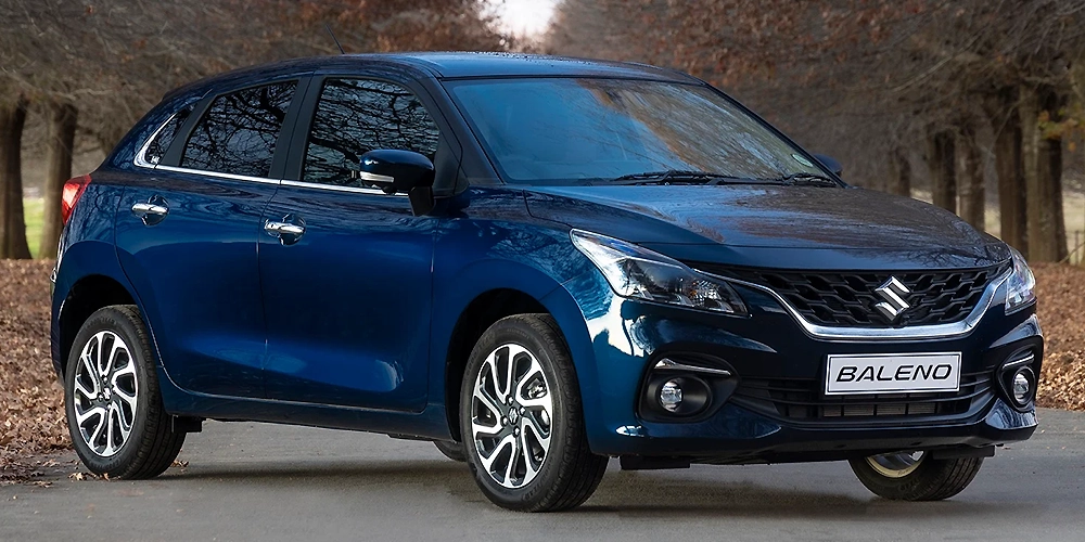 Hire a chauffeur-driven 5-seater Maruti Baleno for stylish, comfortable travel across Kochi & Kerala
