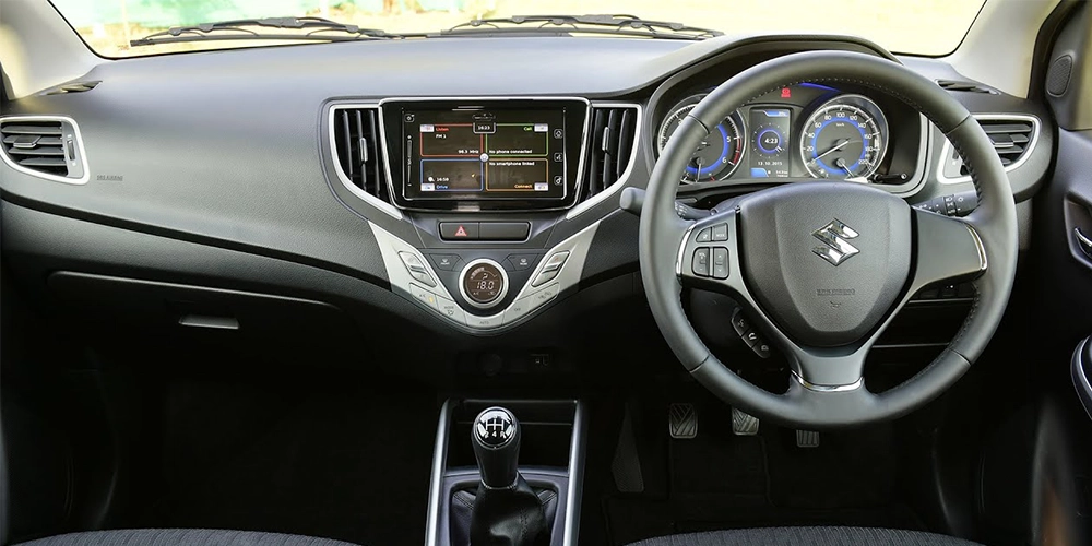 Premium Baleno interior with dual-tone seats, auto AC, SmartPlay screen, and ample cabin comfort