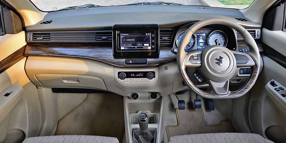 Ertiga rental in Kochi offers premium interiors, dual Air Conditioning vents,and infotainment system