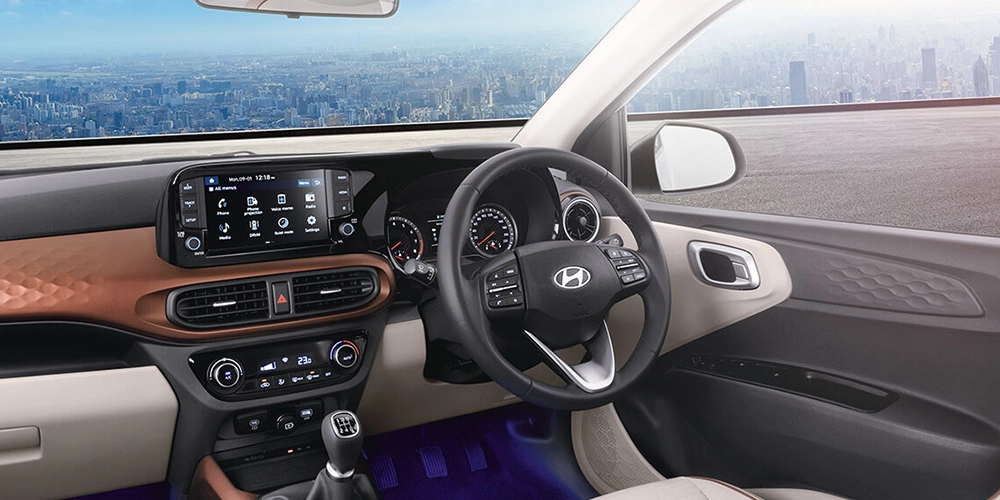 Hyundai Aura interior features modern dashboard, spacious seating and smart infotainment in Kochi