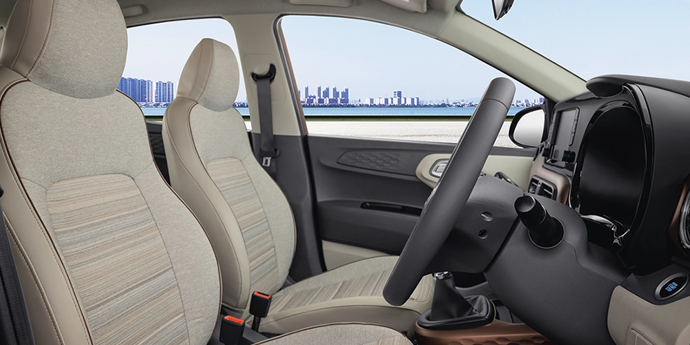 Experience Ride in Hyundai Aura in Kochi with fabric upholstery, rear armrest comfortable seating