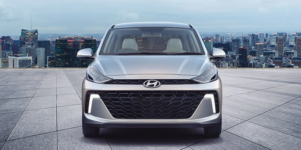 Rent the Hyundai Aura in Kochi showcasing its sleek design and comfortable exterior for daily use.