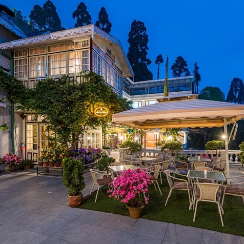  Family enjoying a cozy hotel stay in Darjeeling with scenic mountain views and peaceful vibes