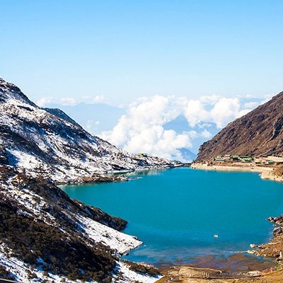 Peaceful view of Tsomgo Lake in Sikkim, a must-visit destination on your Himalayan journey