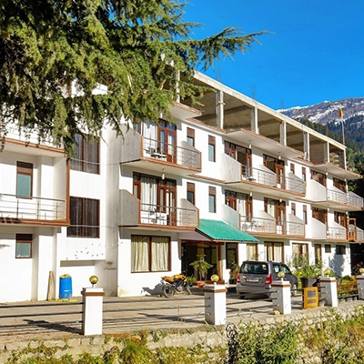 Relaxing hotel room in Shimla Manali tour package offering comfort and stunning mountain views