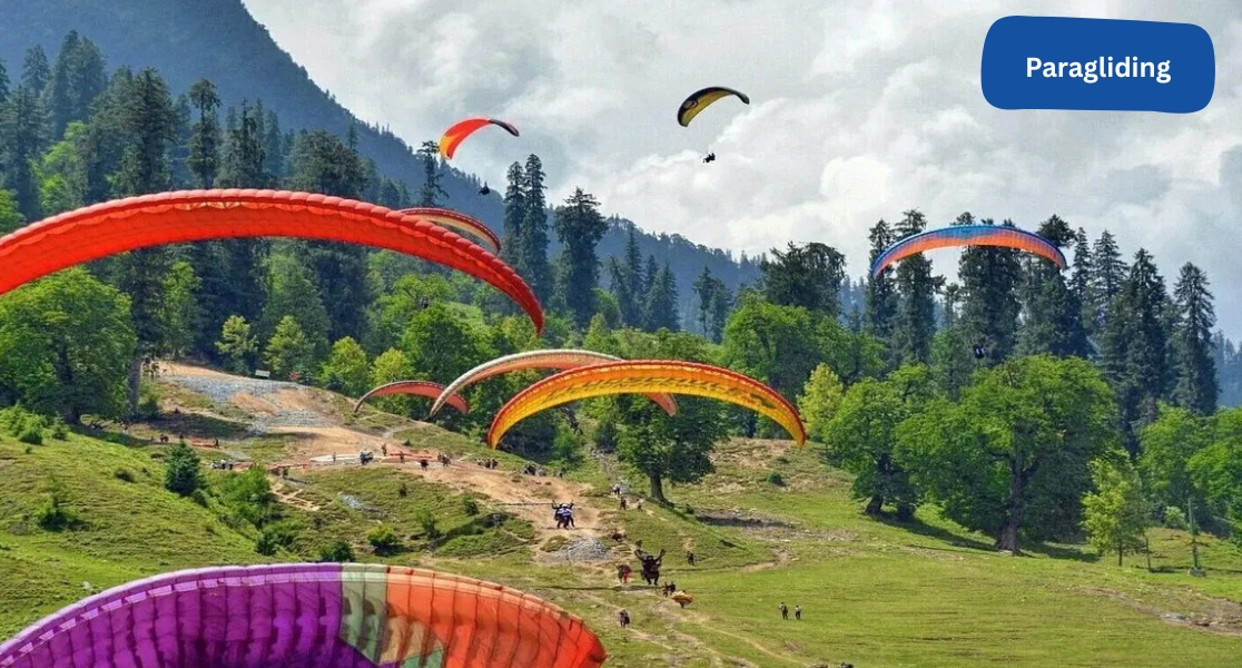 Tourist enjoying a thrilling paragliding ride in Manali as part of an exciting adventure packages